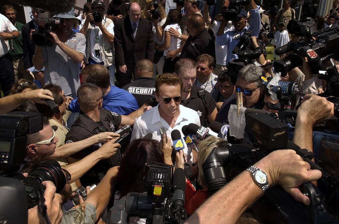 Arnold Schwarzenegger is swarmed by the media during the opening ceremonies of the Inner-City games on Friday, August 8, 2003, a day after he took out papers to run for California governor in the recall election. John Decker/Sacramento Bee file