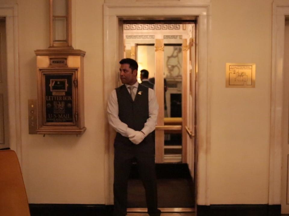 Elevator man posting up - Always at the Carlyle