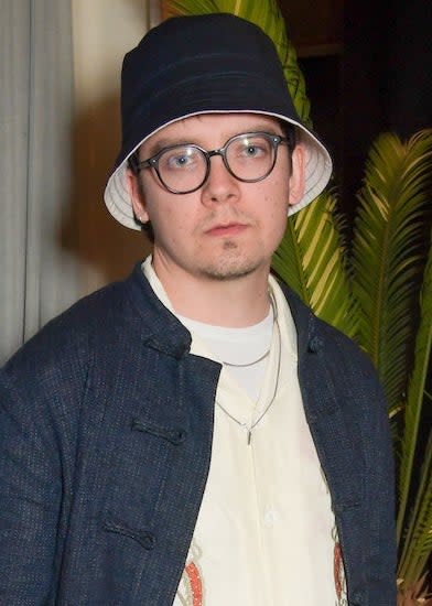 closeup of Asa in a bucket hat