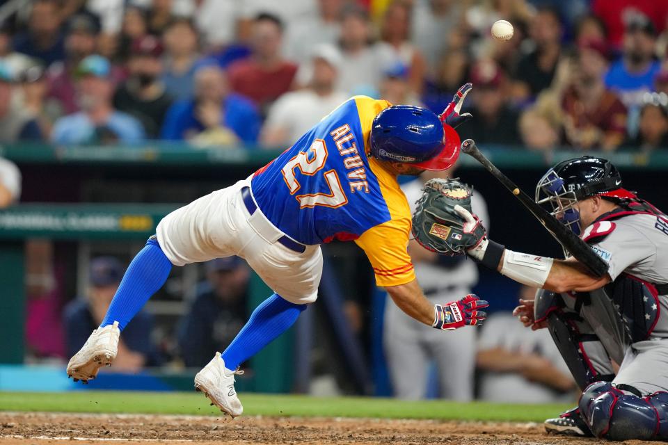 Jose Altuve is hit by a pitch by Daniel Bard during the Venezuela-United States World Baseball Classic quarterfinal game at loanDepot Park.