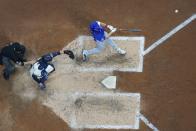 Chicago Cubs' Seiya Suzuki hits a two-run home run during the fifth inning of a baseball game against the Milwaukee Brewers Tuesday, July 5, 2022, in Milwaukee. (AP Photo/Morry Gash)