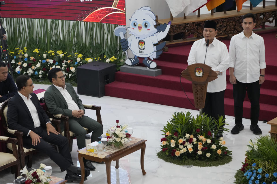 Indonesian Defense Minister and president-elect Prabowo Subianto, second right, with his running mate Gibran Rakabuming Raka, the eldest son of Indonesian President JokoWidodo, right, delivers a speech as losing presidential candidates Presidential candidate Anies Baswedan, left, and his running mate Muhaimin Iskandar listen, during Subianto and Raka's formal declaration as president and vice president-elect at the General Election Commission building in Jakarta, Indonesia, Wednesday, April 24, 2024. Indonesia’s electoral commission formally declared Subianto as the elected president in a ceremony on Wednesday after the country’s highest court rejected appeals lodged by two losing presidential candidates who are challenging his landslide victory. (AP Photo/Dita Alangkara)
