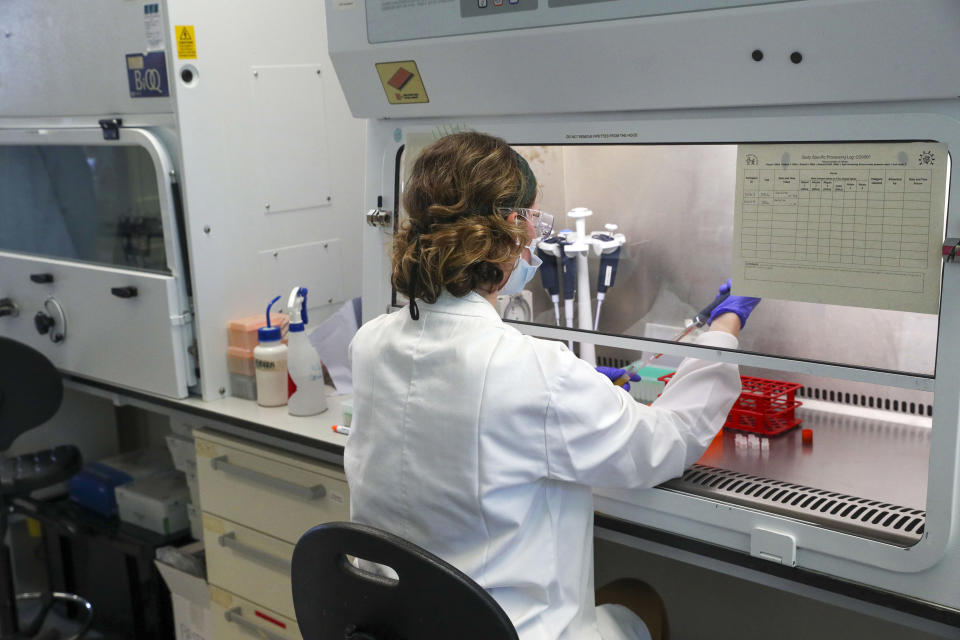 File photo dated 24/06/2020 of a scientist at work in the manufacturing laboratory where a vaccine against Covid-19 has been produced at the Oxford Vaccine Group's facility at the Churchill Hospital in Oxford. Data shows that a coronavirus vaccine developed by AstraZeneca and Oxford University can prevent 70.4% of people from getting Covid-19.