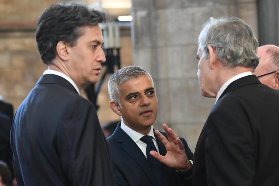 Ed Miliband and Sadiq Khan chat with Gordon Brown at Southwark Cathedral (PA)