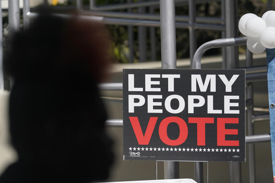 FILE - A woman attends an event for Democratic candidate for Florida governor Charlie Crist at an early voting location Nov. 6, 2022, in Miami. (AP Photo/Lynne Sladky, File)