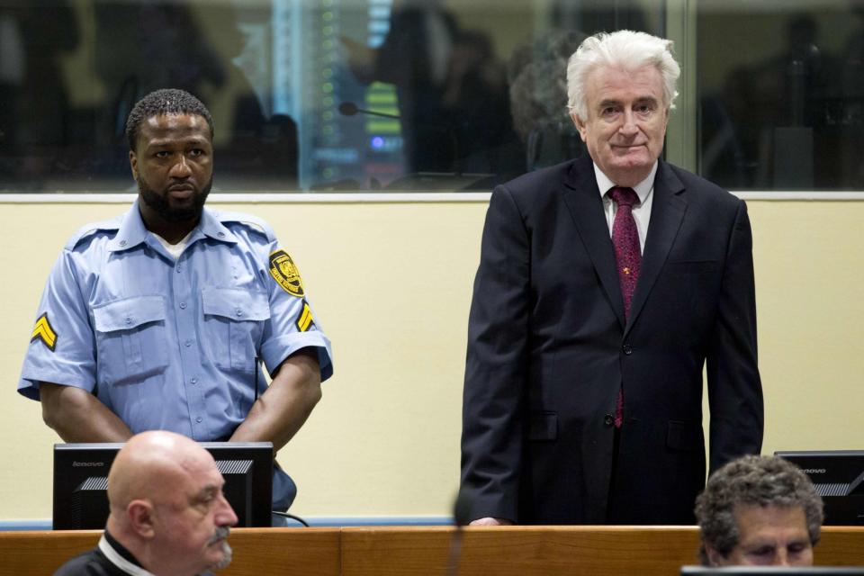 Former Bosnian Serb leader Radovan Karadzic looks on as he arrives at the court room of the International Residual Mechanism for Criminal Tribunals in The Hague. (AFP/Getty Images)