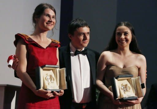 Actresses Cristina Flutur (L) and Cosmina Stratan shared the best actress prize for their roles in director Cristian Mungiu's (C) "Beyond the Hills" at the 65th Cannes film festival on May 27. The film is about a nun and her friend who falls victim to a deadly "exorcism"