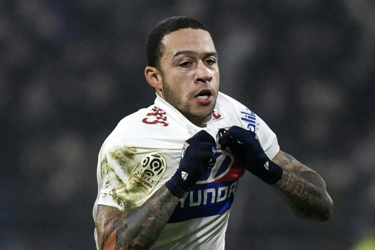 Lyon's forward Memphis Depay celebrates after scoring during the French L1 football match between Olympique Lyonnais and Paris-Saint Germain (PSG)