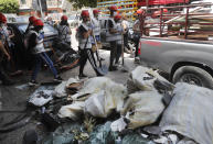 Students who volunteered to clean damaged houses, apartments and give other assistance, prepare to remove debris on a street that was damaged in last week's explosion, in Beirut, Lebanon, Tuesday, Aug. 11, 2020. The explosion that tore through Beirut left around a quarter of a million people with homes unfit to live in. In the absence of the state, residents of Beirut opened their homes to relatives, friends and neighbors. And on the streets, it was young volunteers with brooms and shovels, not government workers, who cleared the littered streets. (AP Photo/Hussein Malla)