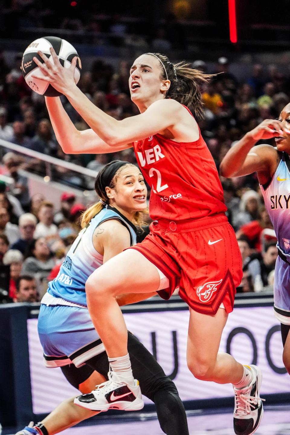 Indiana Fever guard Caitlin Clark (22) drives toward the hoop during a game against the Chicago Sky.