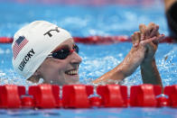 Katie Ledecky, of the United States, reacts after winning a heat of the women's 800-meter freestyle at the 2020 Summer Olympics, Thursday, July 29, 2021, in Tokyo, Japan. (AP Photo/Charlie Riedel)