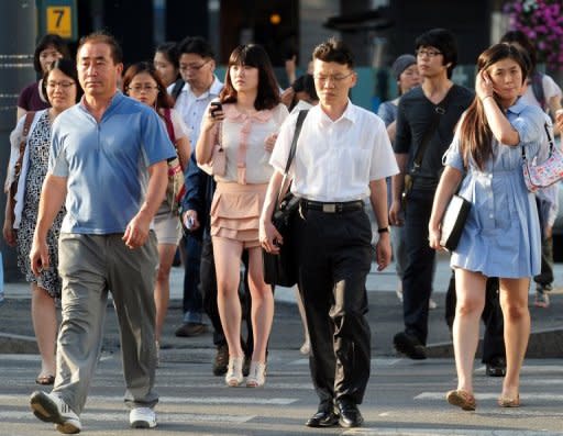 South Korean office workers in Seoul. President Lee Myung-Bak has repeatedly urged college students to lower their standards and seek jobs at lesser-known companies, and has adopted more programmes to support vocational high schools