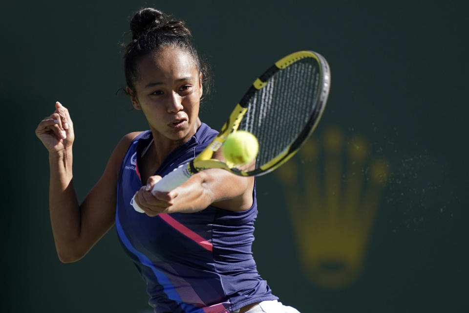 Leylah Fernandez, of Canada, returns a shot to Shelby Rogers at the BNP Paribas Open tennis tournament Tuesday, Oct. 12, 2021, in Indian Wells, Calif. (AP Photo/Mark J. Terrill)