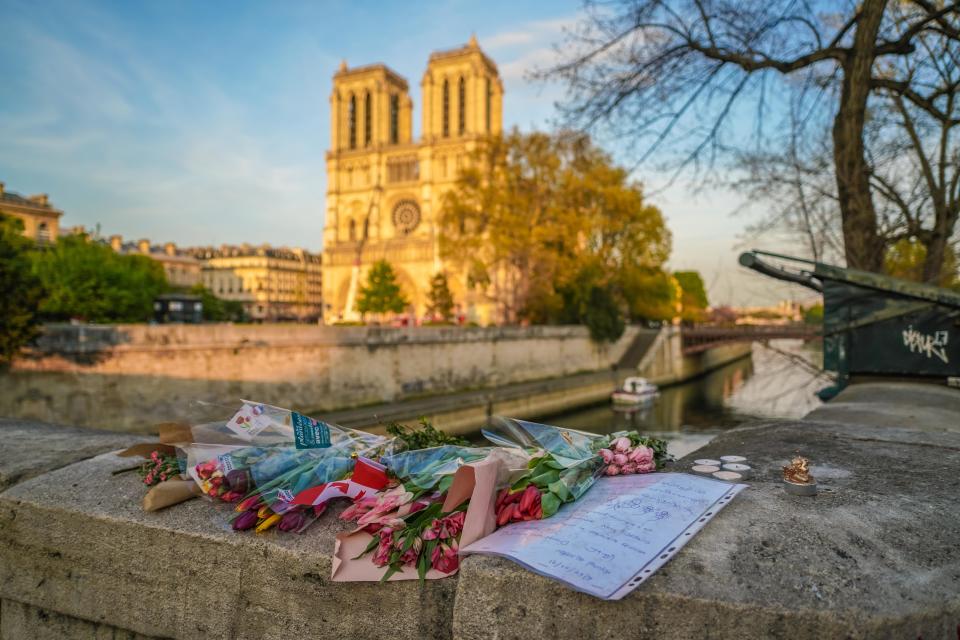 Flowers are placed in front of Notre Dame Cathedral on April 18, 2019 in Paris, France.&nbsp; (Photo: Edward Berthelot via Getty Images)