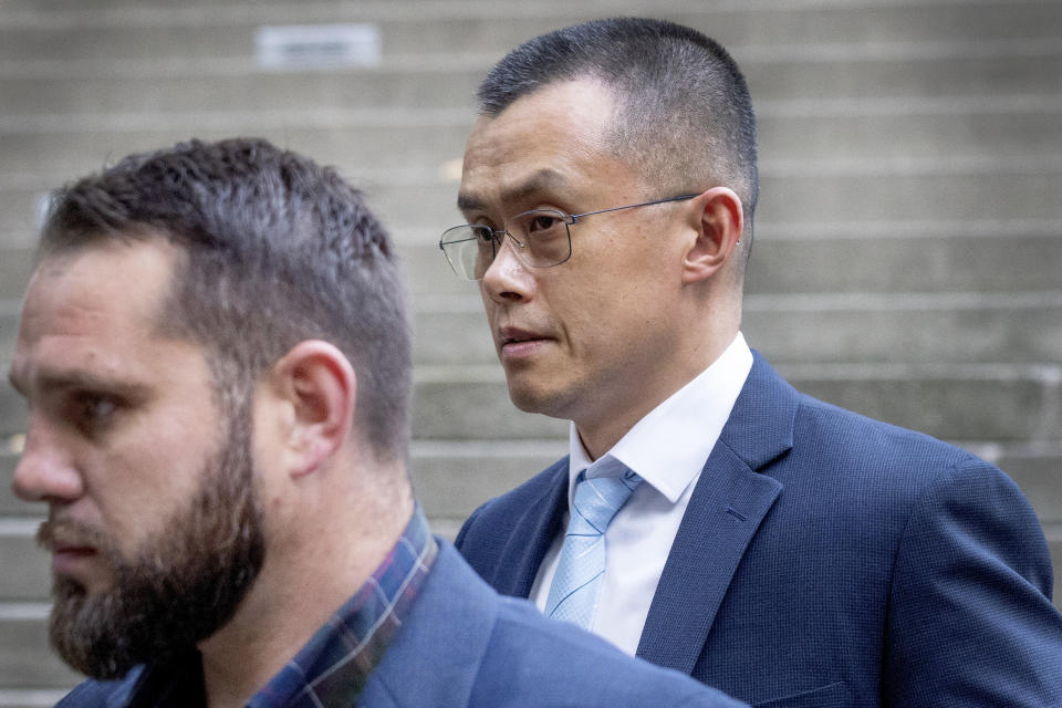 File - Binance founder and CEO Changpeng Zhao, right, leaves federal court in Seattle on Nov. 21, 2023, after pleading guilty to violations of U.S. anti-money laundering laws. (Ken Lambert/The Seattle Times via AP, File)