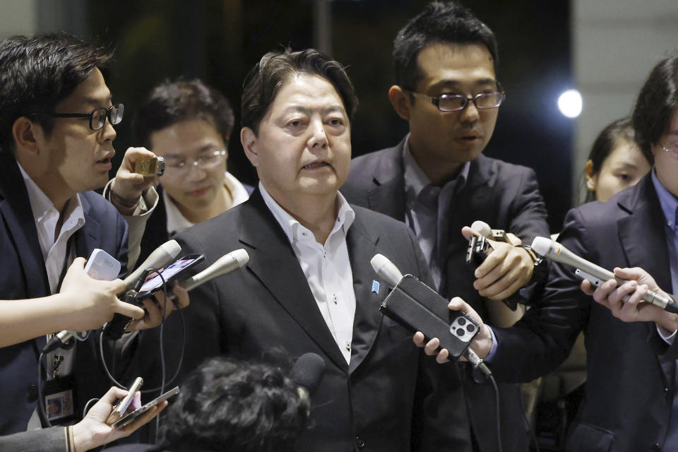 Japan's Chief Cabinet Secretary Yoshimasa Hayashi, center, arrives at the prime minister's office in Tokyo following a rocket launch by North Korea, Monday, May 27, 2024. A rocket launched by North Korea to deploy the country's second spy satellite exploded shortly after liftoff Monday, state media reported, in a setback for leader Kim Jong Un's hopes to field satellites to monitor the U.S. and South Korea. (Kyodo News via AP)