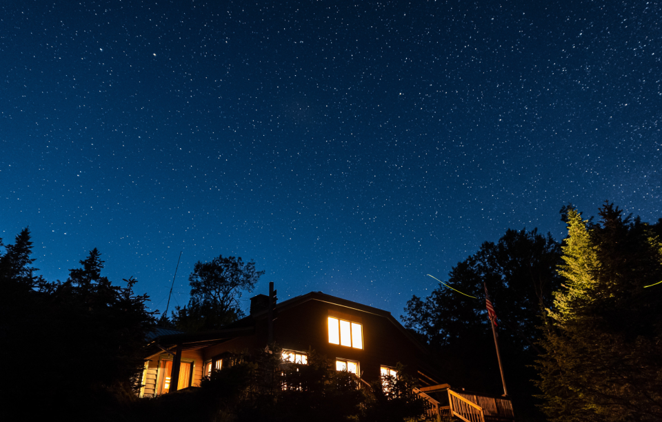 Thousands of stars shine above Johns Brook Lodge in the Adirondack Park, NY.