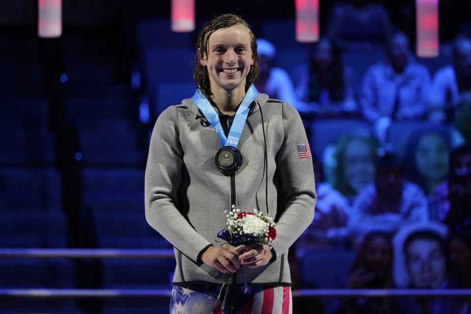 Katie Ledecky smiles at the medal ceremony after winning the women's 1500 freestyle during wave 2 of the U.S. Olympic Swim Trials on Wednesday, June 16, 2021, in Omaha, Neb.(AP Photo/Charlie Neibergall)