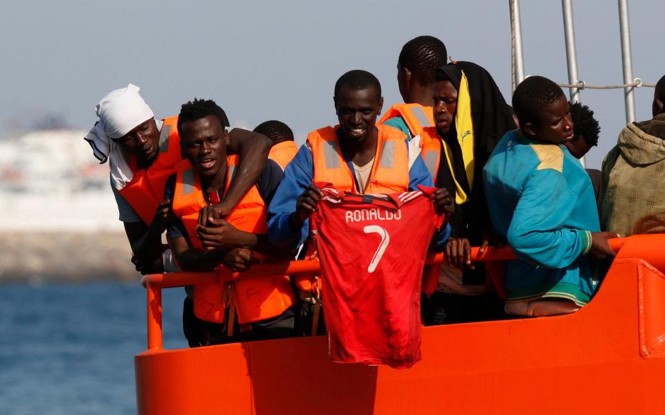  Rescued migrants react as they arrive to the port of Almeria, southern Spain, 16 August 2017 - EFE