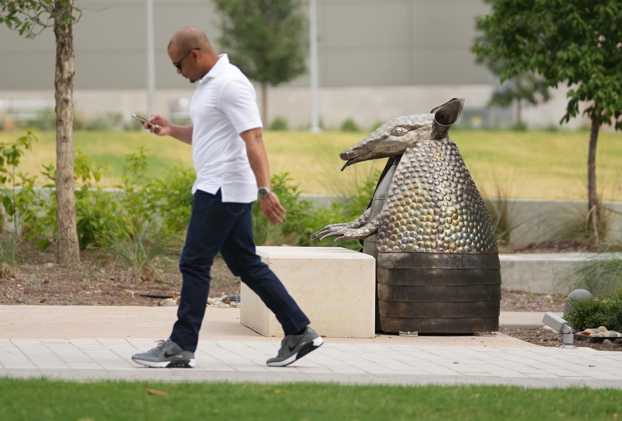 An arresting armadillo sculpture appears to pop up from the concrete on the Capitol Mall.