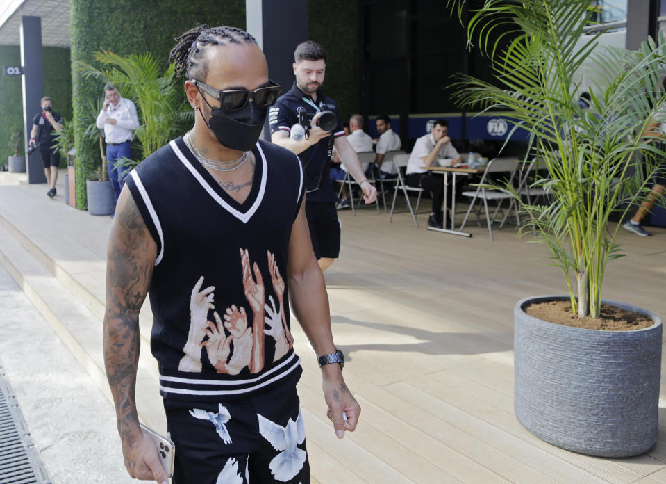 Mercedes driver Lewis Hamilton of Britain arrives at the Formula One corniche circuit, in Jiddah, Saudi Arabia, Thursday, Dec. 2, 2021. The F1 race, which will take place from Dec. 3-5, will be the first time Saudi Arabia hosts the premier sporting event. (AP Photo/Amr Nabil)