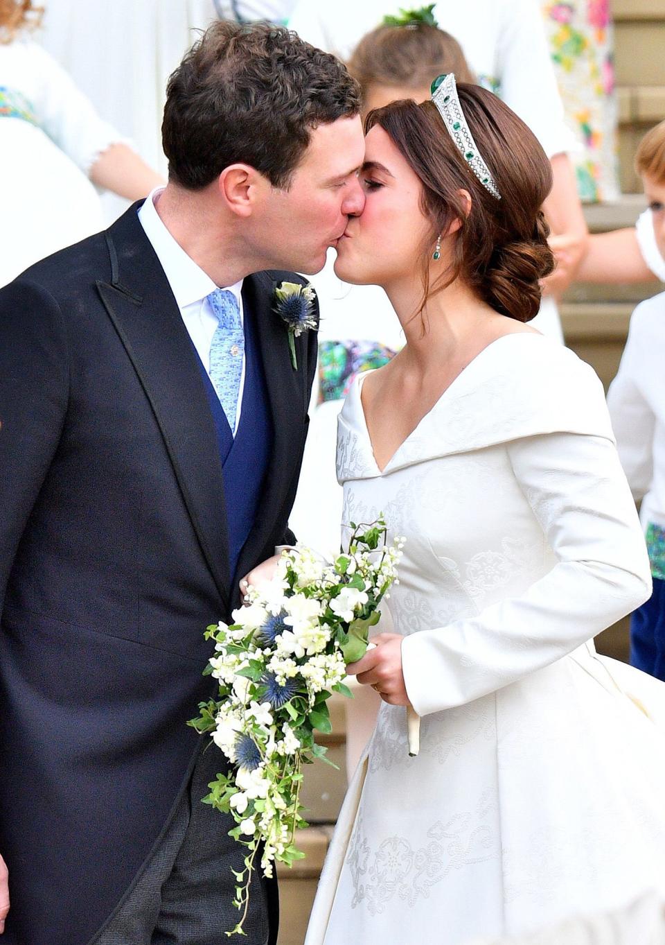 They shared their first kiss as a married couple on the stairs of St. George's Chapel.