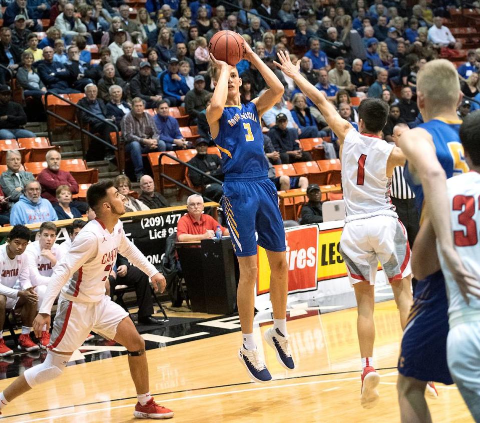 Ripon Christian’s Cade Alger (3) shoots a three point shotduring the Sac-Joaquin Section Division VI championship game with Sacramento Adventist at the University of the Pacific in Stockton, Calif., on Friday, March 2, 2018.