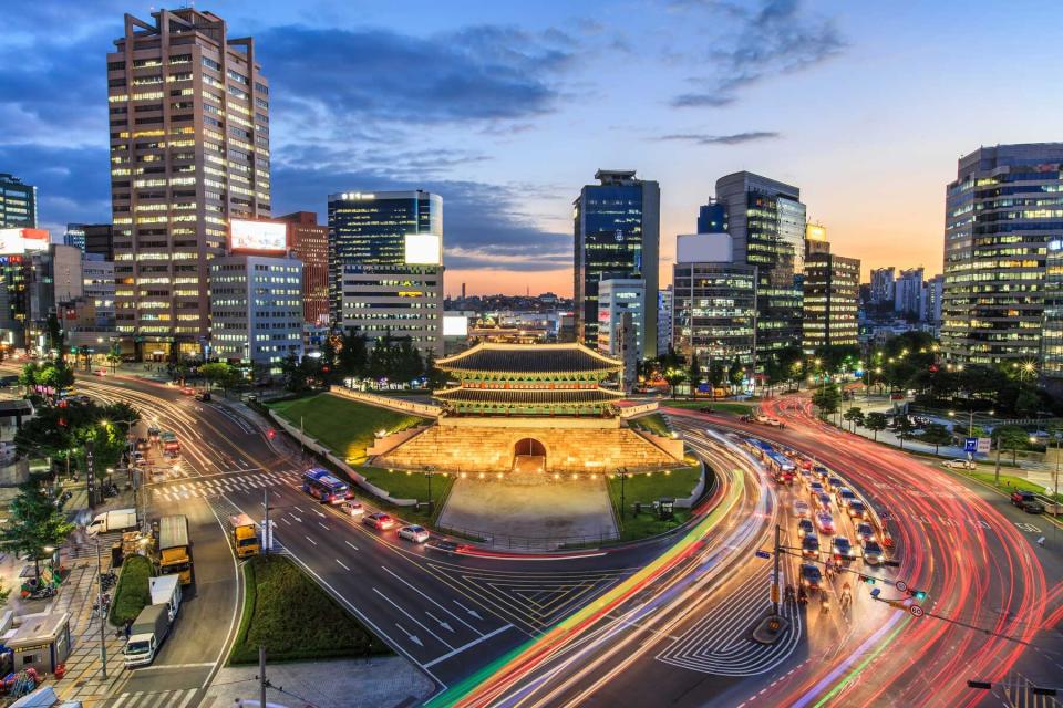 Old fortress gate and modern city of Seoul, Korea, voted one of the best cities in the world