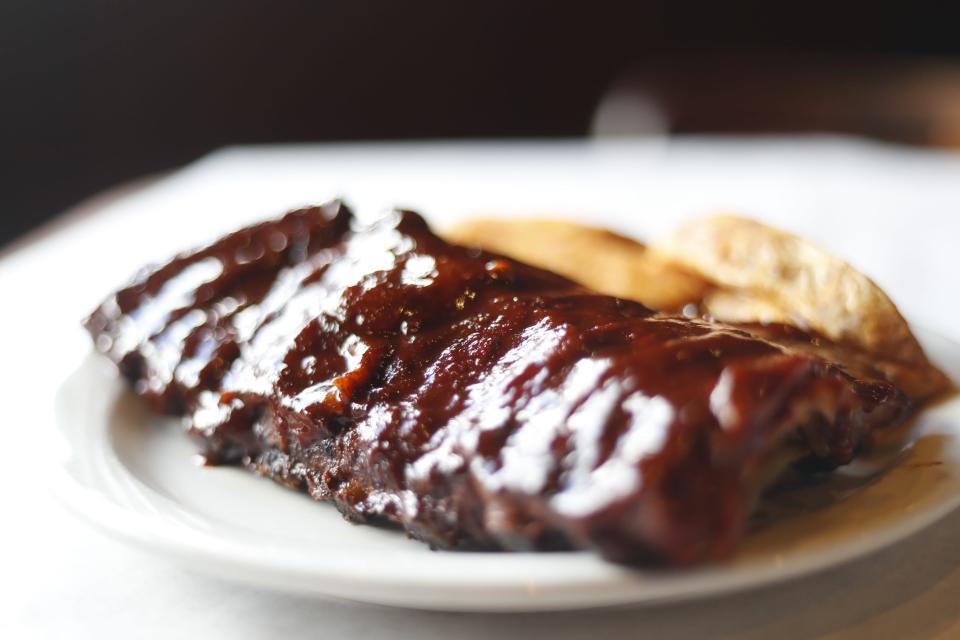 The “full slab rib dinner” can be seen on a table inside of 101-year-old Leonard’s BBQ before they move later this month on August 16, 2023 at 5465. Fox Plaza Drive in Memphis, Tenn.