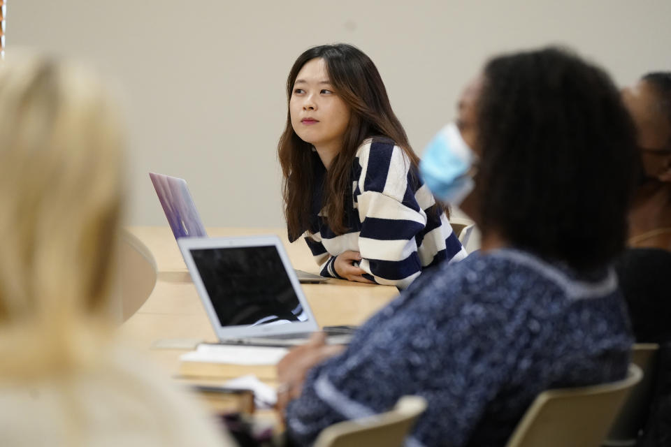 Susie Kim listens along with other students during a ministry class at the Southwestern Baptist Theological Seminary in Fort Worth, Texas, Thursday, Nov. 18, 2021. (AP Photo/LM Otero)