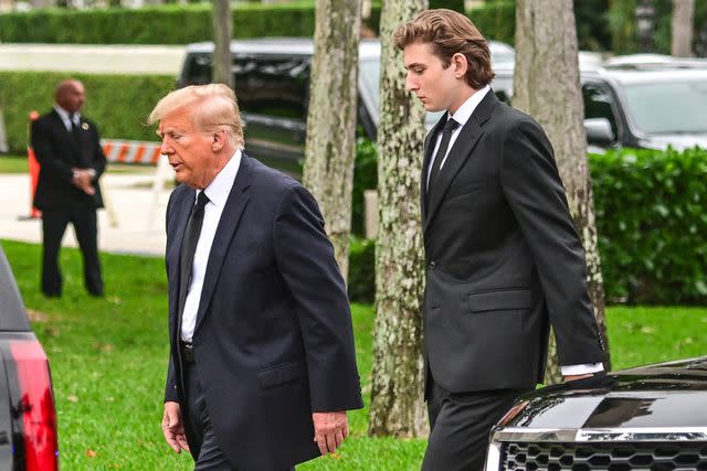 <p>GIORGIO VIERA/AFP via Getty Images</p> Donald and Barron Trump attend the funeral of Melania Trump's mother, Amalija Knavs, on Jan. 9, 2024