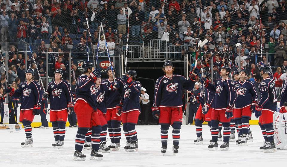 Blue Jackets players wave to the fans after losing a playoff series to the Red Wings in 2009.