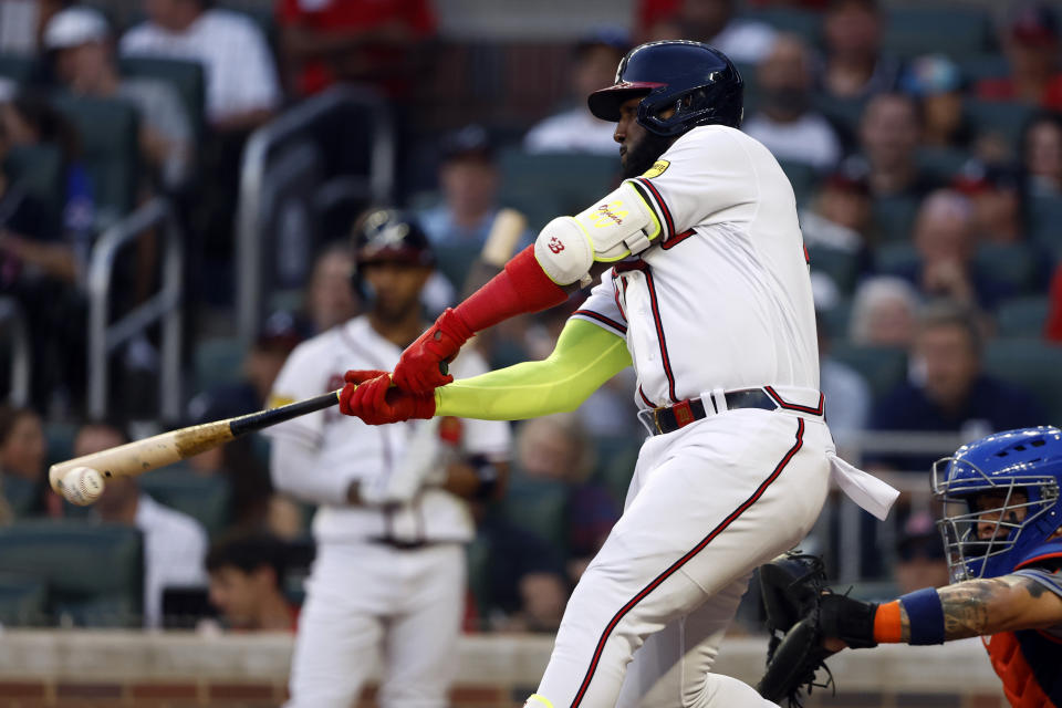 Atlanta Braves' Marcell Ozuna hits a double during the second inning of a baseball game against the New York Mets, Tuesday, Aug. 22, 2023, in Atlanta. (AP Photo/Butch Dill)