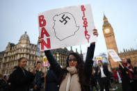 <p>A protester holds a placard during a protest against U.S. President Donald Trump in London, Feb. 20, 2017. (Photo: Justin Tallis/AFP/Getty Images) </p>