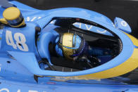 Jimmie Johnson sits in his car during qualifications for the Indianapolis 500 auto race at Indianapolis Motor Speedway, Saturday, May 21, 2022, in Indianapolis. (AP Photo/Darron Cummings)