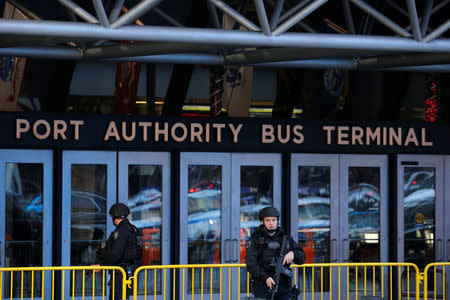 Police officers stand guard outside the New York Port Authority Bus Terminal in New York City, U.S. December 11, 2017 after reports of an explosion. REUTERS/Lucas Jackson