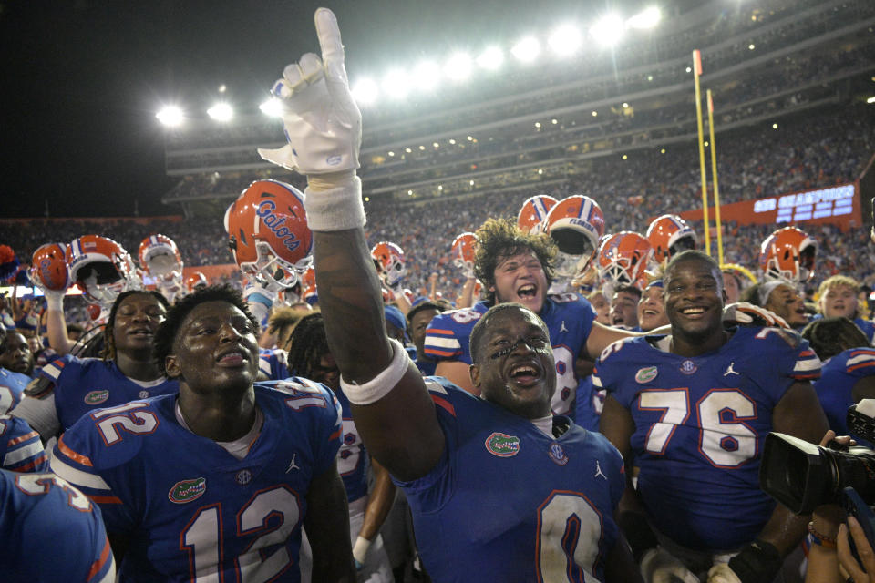Florida safety Trey Dean III (0) and teammates celebrate after defeating Utah in an NCAA college football game, Saturday, Sept. 3, 2022, in Gainesville, Fla. (AP Photo/Phelan M. Ebenhack)