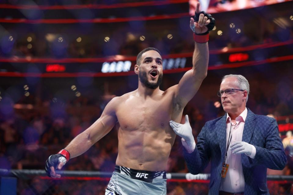 Jul 29, 2023; Salt Lake City, Utah, USA; Gabriel Bonfim (red gloves) reacts to defeating Trevin Giles (blue gloves) during UFC 291 at Delta Center. Mandatory Credit: Jeff Swinger-USA TODAY Sports