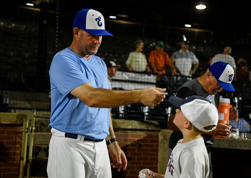 Evansville Otters Manager Andy McCauley talks to seven-year-old Jackson Rumple of Linton after the Otters' game against the Joliet Slammers at Bosse Field in Evansville, Ind., Tuesday, July 6, 2021. 