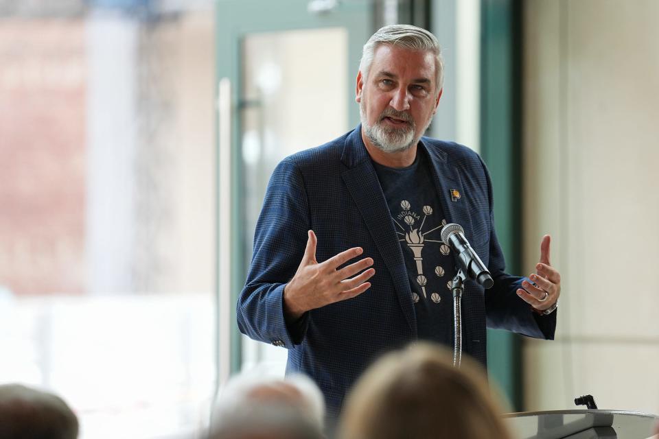 Gov. Eric Holcomb speaks before a ribbon-cutting ceremony for Bicentennial Unity Plaza on Thursday, Aug. 24, 2023, in downtown Indianapolis. The plaza is on the north side of Gainbridge Fieldhouse and will be used for events hosted by the Fever and Pacers, concerts and other events. It features art installations and a basketball court that will become an ice skating rink during winter months.