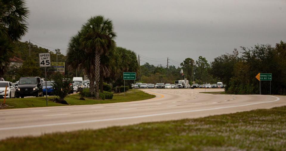 Traffic backs on Daniels Parkway in Fort Myers heading west towards I-75 during morning rush hour on Tuesday, Nov. 14, 2023.