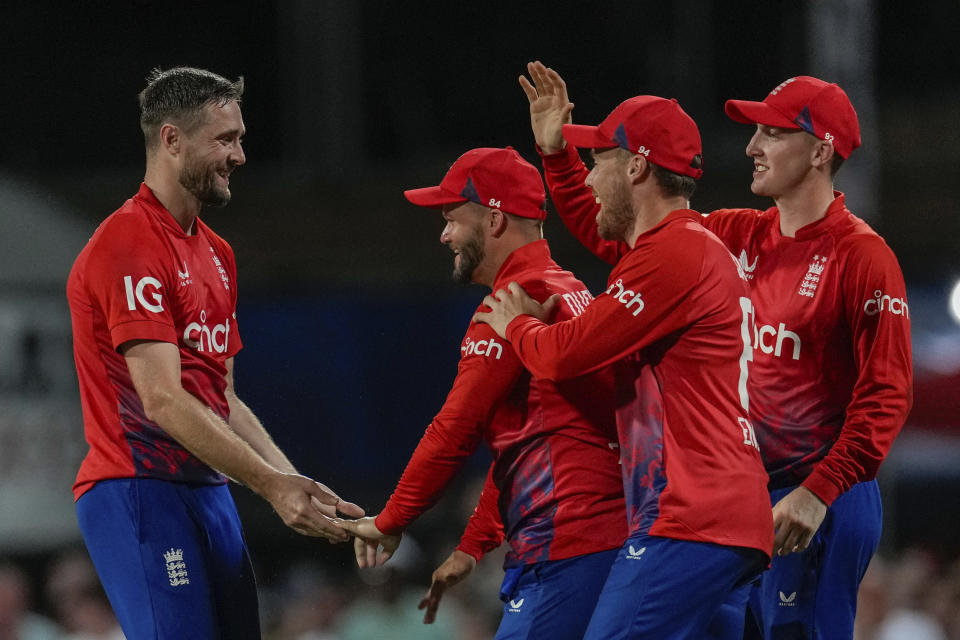 England's Ben Duckett, second from left, celebrates after taking the catch to dismiss West Indies' Brandon King during the first T20 cricket match at Kensington Oval in Bridgetown, Barbados, Tuesday, Dec. 12, 2023. (AP Photo/Ricardo Mazalan)