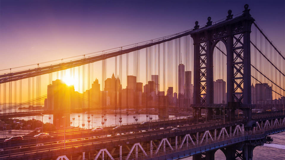 New York City - beautiful sunset over manhattan with manhattan and brooklyn bridge - Image.