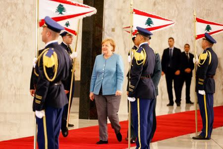 German Chancellor Angela Merkel reviews an honor guard at the presidential palace in Baabda, Lebanon June 22, 2018. REUTERS/Mohamed Azakir