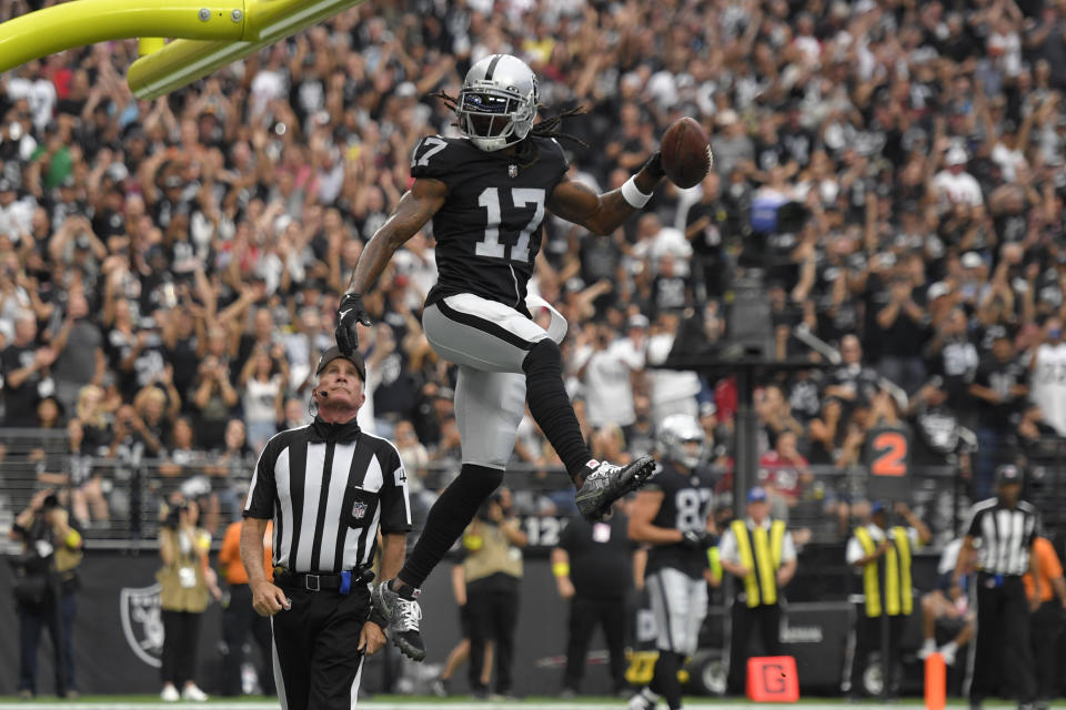 Las Vegas Raiders wide receiver Davante Adams (17) celebrates after a touchdown reception during the first half of an NFL football game against the Arizona Cardinals Sunday, Sept. 18, 2022, in Las Vegas. (AP Photo/David Becker)