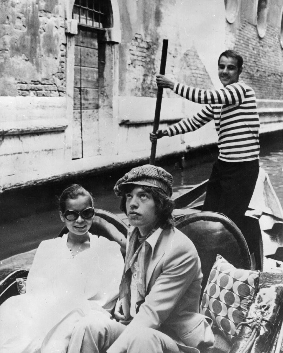 <p>Mick and Bianca Jagger on the Grand Canal in Venice after their honeymoon in Saint Tropez, 1971.</p>