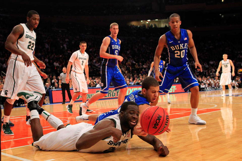 NEW YORK - NOVEMBER 15: Draymond Green #23 of the Michigan State Spartans reaches for the ball over Seth Curry #30 of the Duke Blue Devils during the 2011 State Farms Champions Classic at Madison Square Garden on November 15, 2011 in New York City. (Photo by Chris Trotman/Getty Images)