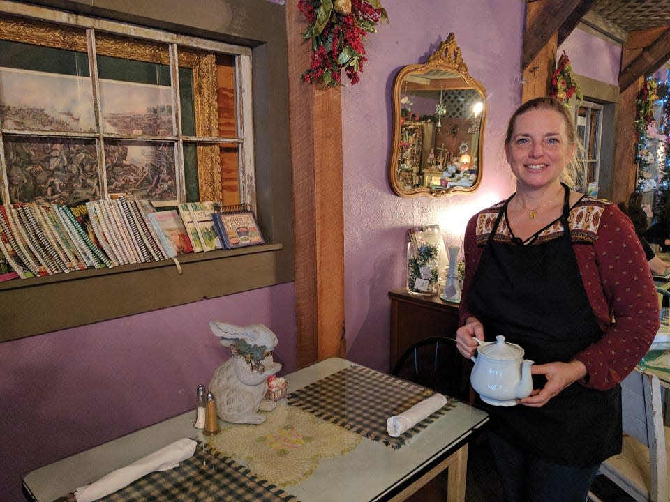 Monica Tripp, owner of The Emerald Tea Room in East Peoria, stands inside the restaurant last month. Tripp said her success for staying in business for two decades is due in part to the uniqueness of her tea room. The business is located at 132 McKinley St., East Peoria.