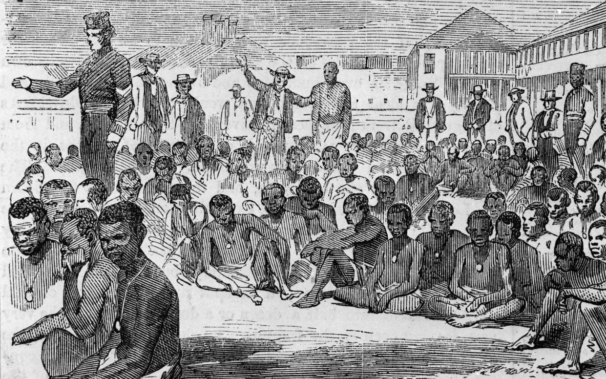 1857: A group of liberated slaves on the parade at Fort Augusta, Jamaica, after the slave ship they were imprisoned in was captured by an English destroyer. - HultonArchive/Illustrated London News/Getty Images
