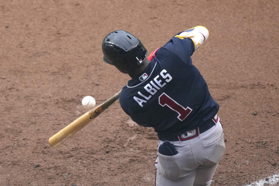 Atlanta Braves' Ozzie Albies singles off Chicago Cubs relief pitcher Michael Fulmer during the fifth inning of a baseball game Saturday, Aug. 5, 2023, in Chicago. (AP Photo/Charles Rex Arbogast)